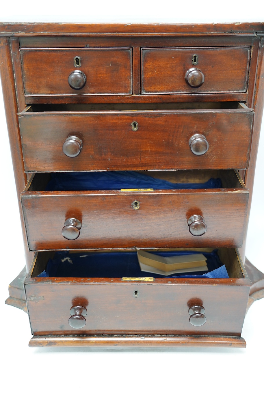 A Victorian mahogany miniature chest, on shaped plinth, 50cm wide, 49cm high. Condition - fair